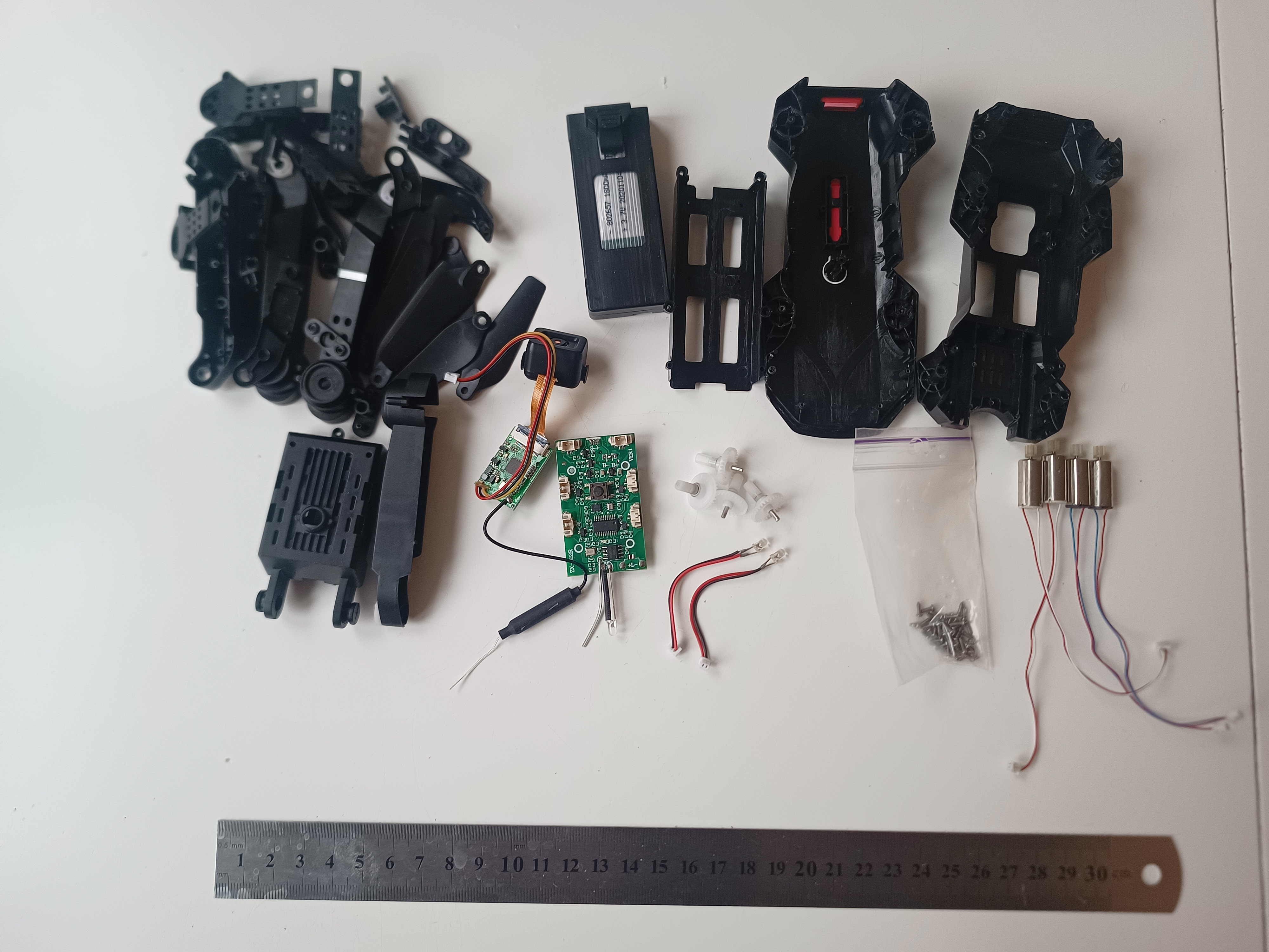 E99 Pro drone fully disassembled into component groups